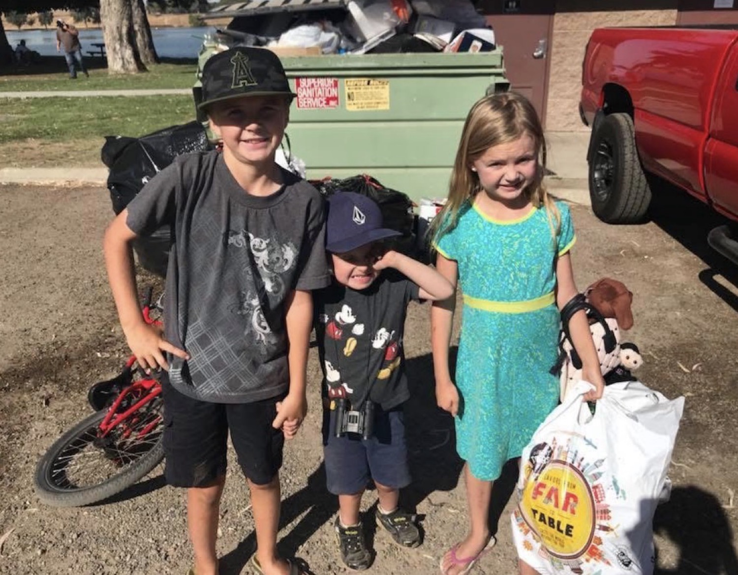 The three kids after a recycling collection